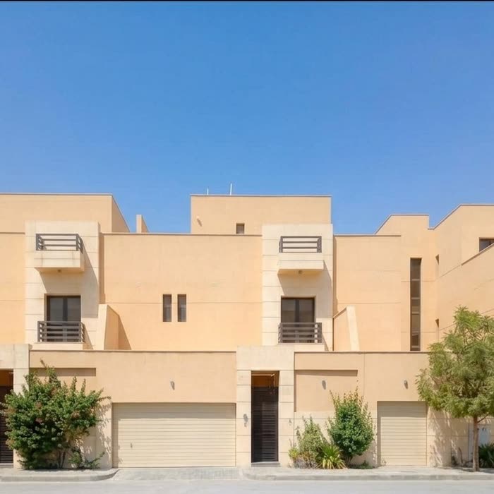 فيلا حديثة بلون الرمل بكتل متراكبة